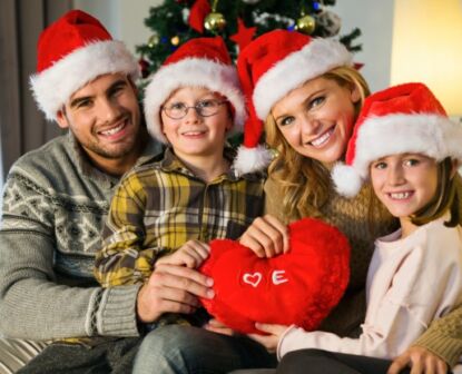 Family smiling and celebrating christmas holiday season