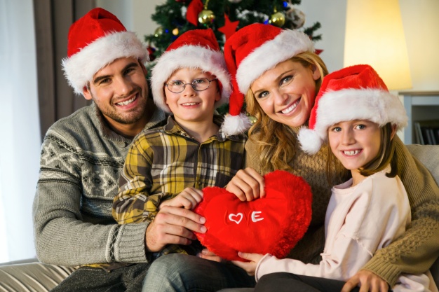 Family smiling and celebrating christmas holiday season